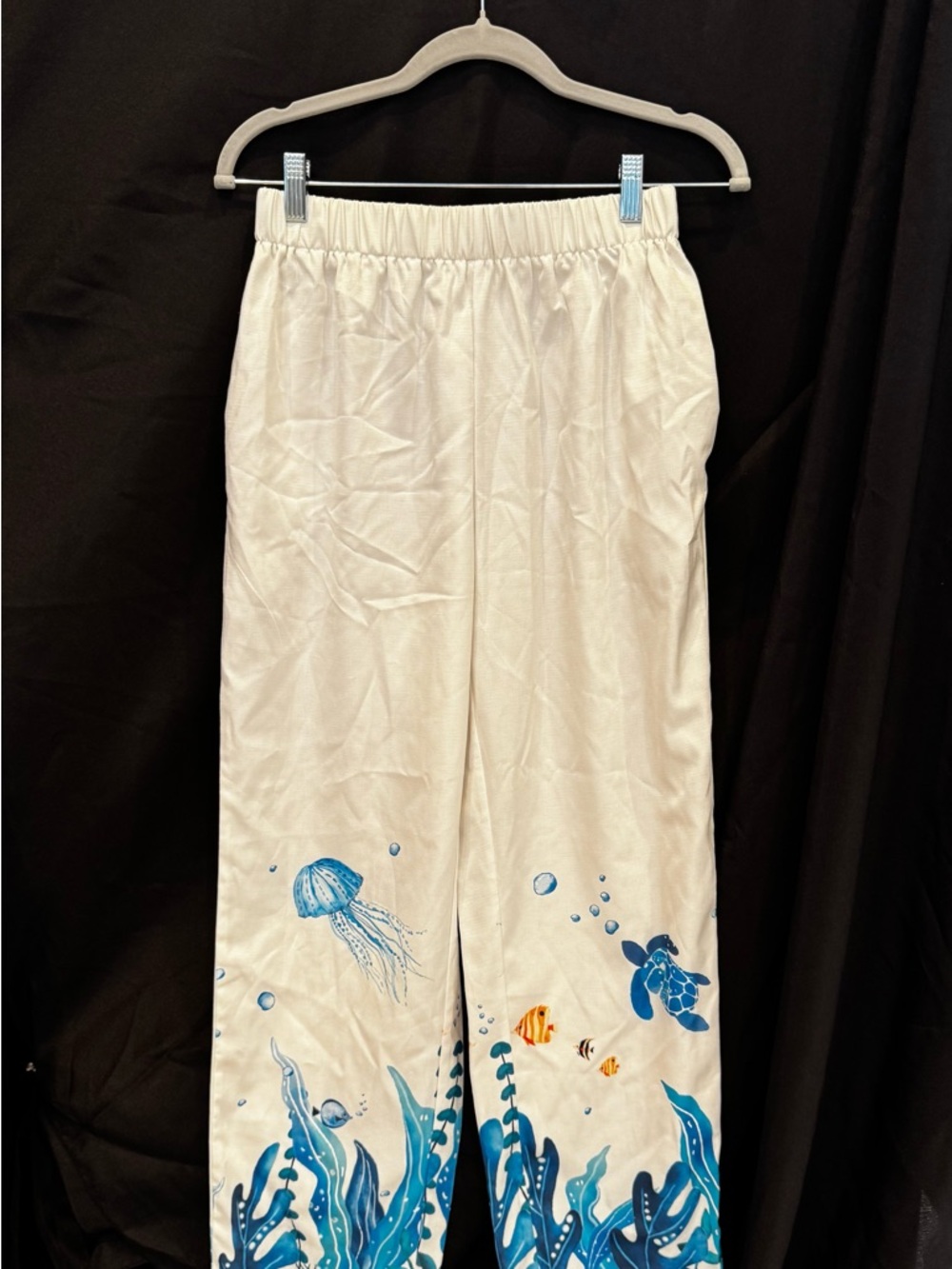 White pants with ocean life print